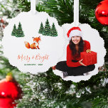 Cute Fox in Winter Woodland Merry and Bright Photo Ornament Karte<br><div class="desc">A Christmas design with woodland / forest animals theme. There is a cute red fox on the white snow background, with groups of green pine trees with snow on the sides. The text "Merry & Bright" is in red handwriting script, with the name and year in smaller green letters under...</div>