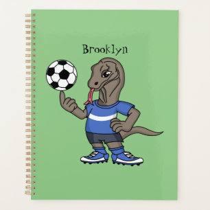 Cute funny Komodo dragon playing soccer cartoon Planer