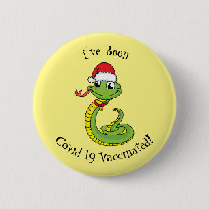 Cute green snake with santa hat cartoon button