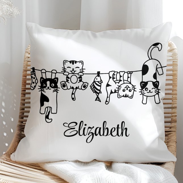 Cute Hanging Kittens Custom Name Kissen (Cute Hanging Kittens Custom Name Throw Pillow in a sunny boho neutral rattan chair.)