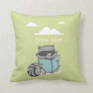 Cute raccoon reading zu book. Green children Kissen