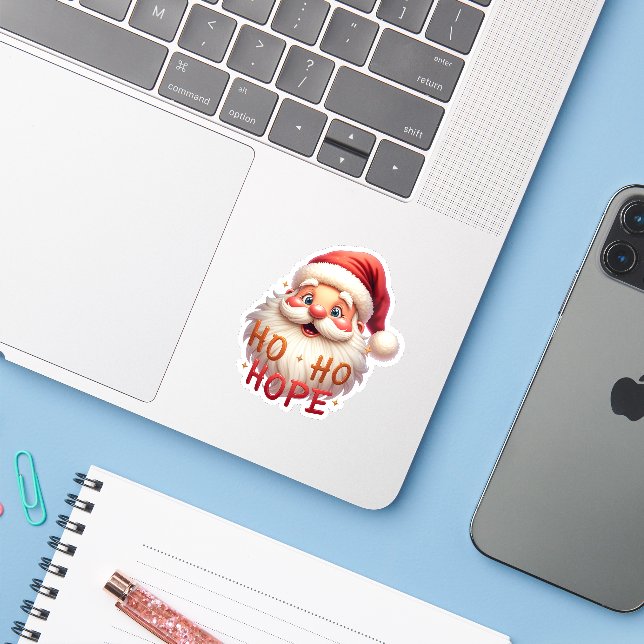 Cute Santa “Ho Ho Hope” Sticker (Laptop mit iPhone)