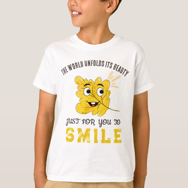 Cute Smiling Leaf "The World Unfolds Its Beauty" T-Shirt (Vorderseite)