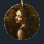 Da- VinciJungfrau der Felsen-Engels-Verzierung Keramikornament<br><div class="desc">Leonardo da Vinci Jungfrau der Felsen-Engelsverzierung. Ölmalerei auf Leinwand 1495-1508. Da Vinci stellte zwei unterschiedliches Madonna der Felsenmalereien während seiner Karriere her. Diese Arbeit kennzeichnet die Jungfrau Mary, die an mit dem Säugling Jesus und dem Säugling Johannes der Täufer als Blicke eines weibliche Engels sitzt. Dieses ist oben des Engels...</div>