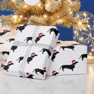 Dachshund in einer Weihnachtsmannmütze Weihnachten Geschenkpapier