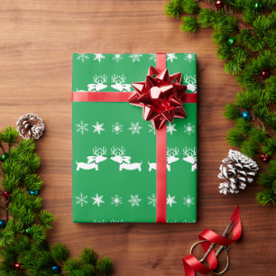 Dackel der weißen Rentiere mit Schneeflocken auf  Geschenkpapier
