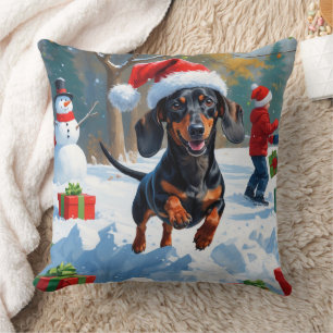 Dackel läuft im Schnee mit Weihnachtsmütze Kissen