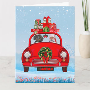 Dackel mit dem Weihnachtsmann im Auto Karte