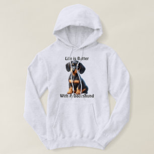Dackel Welpe sitzen und mit unschuldig suchen Hoodie