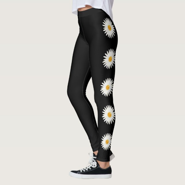 Daisy-Blume in schwarzer Hintergrundfarbe Leggings (Links)