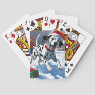 Dalmatiner läuft im Schnee mit Weihnachtshut Spielkarten