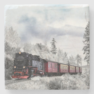 Dampflokomotive fährt durch den Schnee Steinuntersetzer
