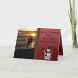 Dancer Silhouette Dance Studio Snowman Weihnachten<br><div class="desc">Tanz oder Yoga Studio Weihnachtskarte. Ideal, um Ihre Schüler während der Weihnachtsferien zu schicken. Auf der Vorderseite ist ein Foto eines Tänzers in der Silhouette bei Sonnenuntergang am Strand. Ein niedlicher Schneemann steht auf einem roten Christmasy-Hintergrund zur Seite. Im Inneren ist ein roter Hintergrund mit dem gleichen niedlichen Schneemann, und...</div>