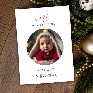 Das erste Weihnachtsgeschenk des Babys im Foto Feiertagskarte