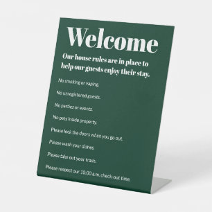 Das Ferienhaus regiert dunkelgrüne, weiße Vorlage Sockelschild