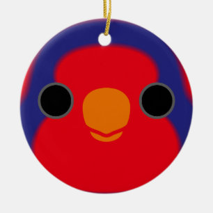 Das Gesicht einer rot-blauen Lory Keramik Ornament