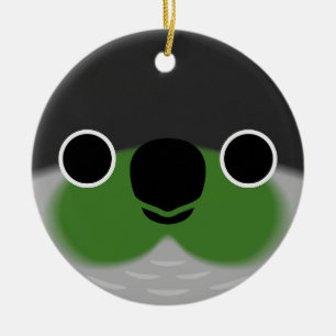 Das Gesicht eines grünen Wangenparakets Keramik Ornament