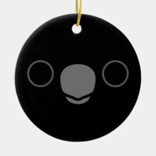 Das Gesicht eines männlichen schwarzen Kakados mit Keramik Ornament