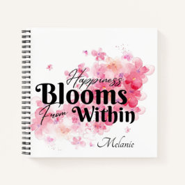 Das Glück blüht aus dem Inneren des Notebooks Notizbuch