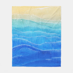 Das Meer und der Strand sind in Aquarellen gehalte Fleecedecke