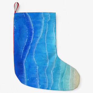 Das Meer und der Strand sind in Aquarellen gehalte Kleiner Weihnachtsstrumpf