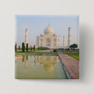 Das stille friedliche Taj Mahal bei Sonnenaufgang Button
