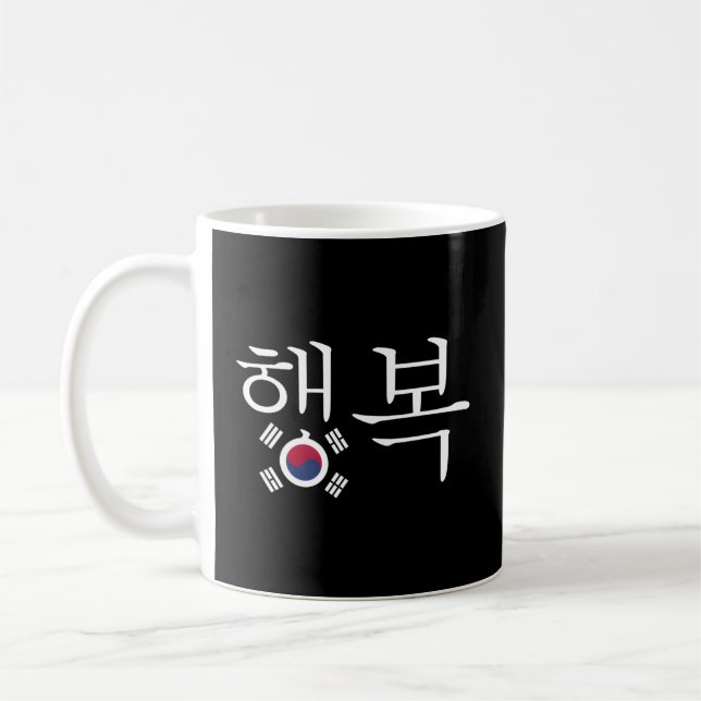 Das Wort glücklich mit der südkoreanischen Fl. Kaffeetasse (Links)