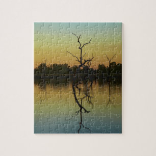 Dead trees reflected in Lily Creek Lagoon, dawn Puzzle