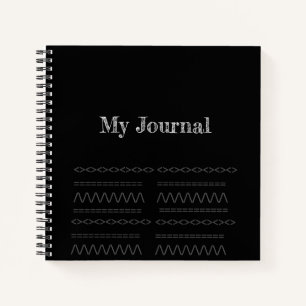 Dekorationsdruck auf einem schwarzen Spiralheft Notizbuch