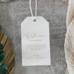 Delikate Gold Calligraphy Wedding Willkommen Geschenkanhänger<br><div class="desc">Diese zarten goldkalligraphischen Begrüßungstags sind perfekt für eine moderne Hochzeit. Das romantische minimalistische Design besticht durch eine hübsche und elegante Champagner-goldgelbe Typografie auf weißem Hintergrund mit einem klaren und schlichten Look. Personalisieren Sie die Tags mit dem Ort Ihrer Hochzeit, eine kurze Begrüßung, Ihre Namen und Hochzeitsdatum. Diese Tags sind ideal...</div>