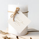 Delikate Goldkalligraphie | Creme Vielen Dank Geschenkanhänger<br><div class="desc">Diese delikate goldene kalligraphische Creme danke Ihnen für die Marken sind perfekt für eine moderne Hochzeit. Das romantische minimalistische Design besticht durch eine hübsche und elegante Champagner-goldgelbe Typografie auf Elfenbein-Creme-Hintergrund mit einem klaren und schlichten Look. Passen Sie diese Tags mit Ihren Namen und Datum an. Ändern Sie den Wortlaut in...</div>