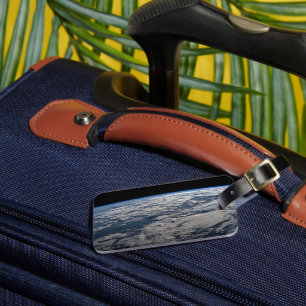 Der Erdwall über einem bewölkten Western Australie Gepäckanhänger