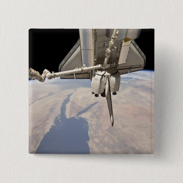 Der hintere Abschnitt des dockten Space Shuttles Button (Vorderseite)