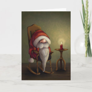 Der kleine Santa in seinem Schaukelstuhl Feiertagskarte