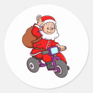 der niedliche santa claus fährt Fahrrad und wav Runder Aufkleber
