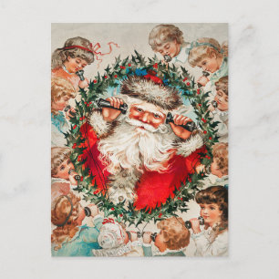 Der Weihnachtsmann auf den Seilhörern, der Kindern Feiertagspostkarte