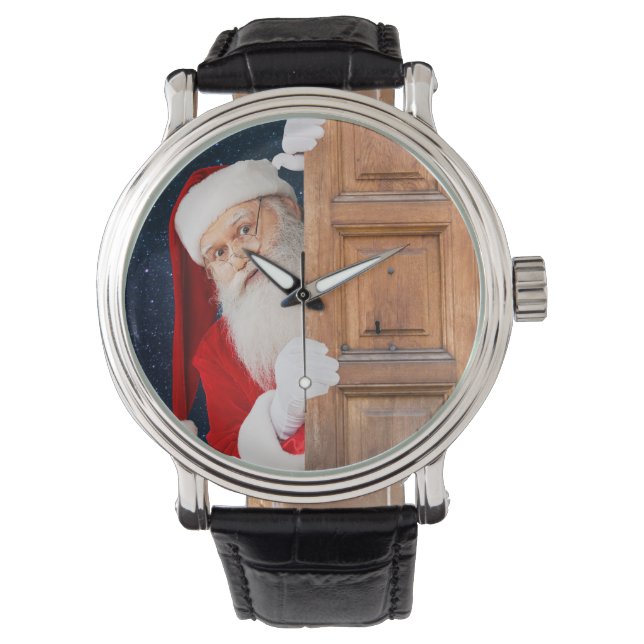 Der Weihnachtsmann versteckt sich hinter einer höl Armbanduhr (Vorderseite)
