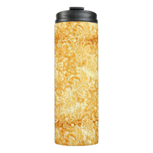 Detail aus Stoff mit goldenem Spitzen Thermosbecher