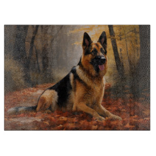 Deutscher Schäferhund im Herbstlaubfall inspiriert Schneidebrett