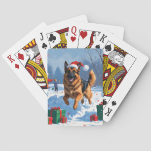 Deutscher Schäferhund läuft mit Weihnachtshut im S Spielkarten