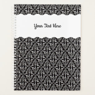 Diamant geformte verzierte Scrolls auf schwarz Planer