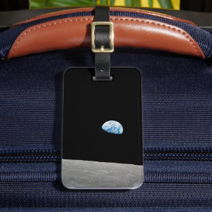 Die Erde erhebt sich über dem Mondlicht. Gepäckanhänger