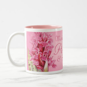 Die größte Tasse der Welt mit rosa Orchideen