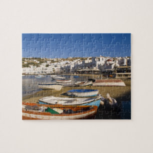 Die Hafenstadt mit farbenfrohen Fischerbooten Puzzle