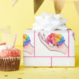 Die Hand einer Frau wiegt eine Regenbogenrose Geschenkpapier
