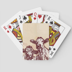 Die Hand mit zwei Kühen zeichnen die Skizze u. Spielkarten