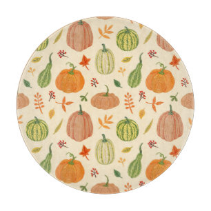 Die Kürbis sind grün und orange, das Muster ist na Schneidebrett