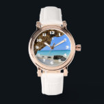 Die Küste des tropischen Strandes mit dem großen F Armbanduhr<br><div class="desc">Eine Uhr mit einem landschaftlichen Naturfoto. Schönes türkisblaues Meer mit einem Sandstrand. Ein großer,  brauner Felsen verleiht dem hellblauen Himmel Schatten.</div>