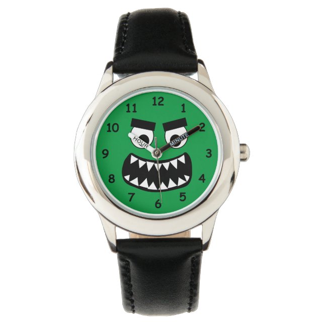 Die lustige Kinderuhr mit grünem Monster gegenüber Armbanduhr (Vorderseite)