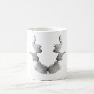 Die Rorschach Test-Tinte befleckt Kopf-Gesichter Tasse